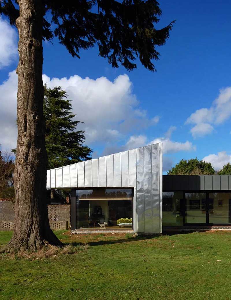 The Wrap House: Stainless Steel Clad Contrasted with Dark Zinc Fascias (Image Courtesy Archinect Firms)