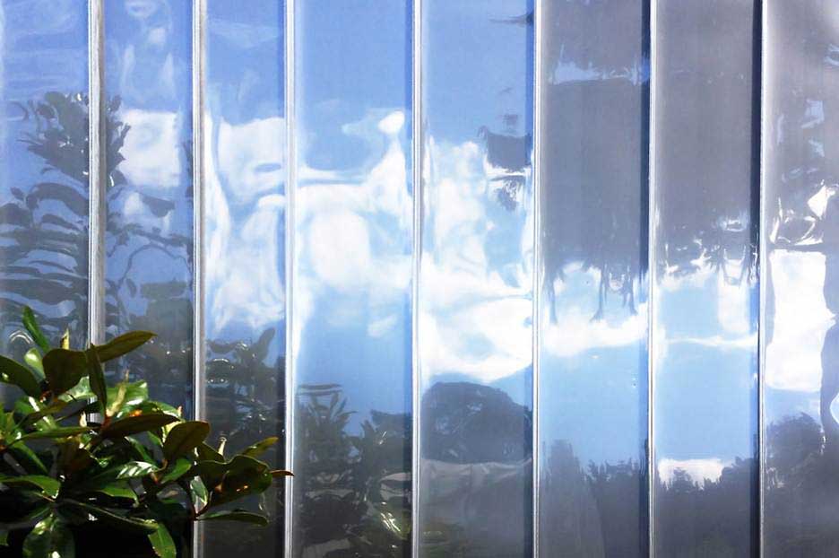 The Wrap House Clad with Reflective Oil-Canning Stainless Steel Finish (Image Courtesy Archinect Firms)